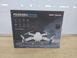Foldable drone retail box showing quadcopter with HD camera and gesture control, Ages 14+