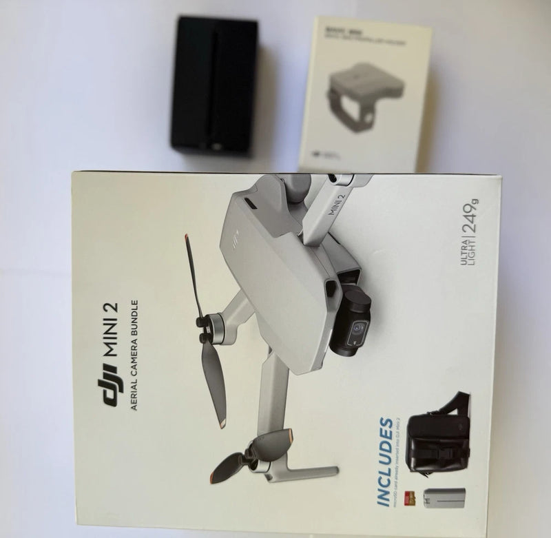 DJI Mini 2 drone with remote controller, shown in retail box