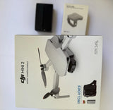 DJI Mini 2 drone with remote controller, shown in retail box
