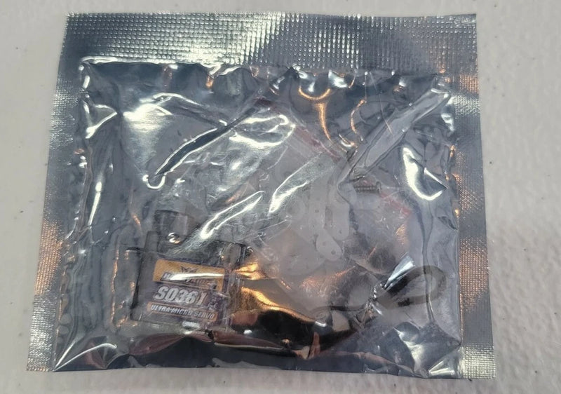 RC micro servo S036 in sealed clear plastic bag, label visible.