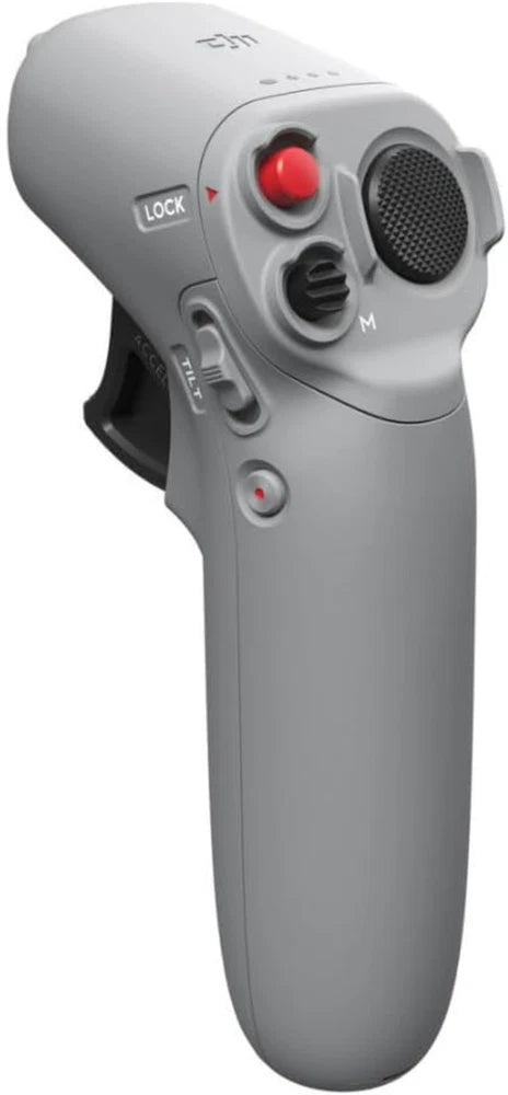 Handheld gray motion controller with red thumb button, lock switch, and speaker grille.