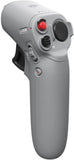 Handheld gray motion controller with red thumb button, lock switch, and speaker grille.