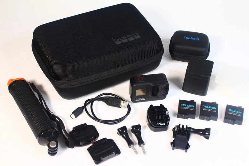 GoPro Hero 8 action camera kit with triple charger, three batteries, and carry case
