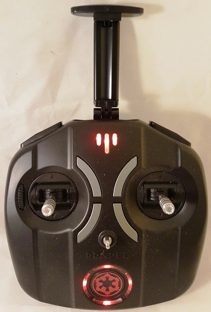 Black remote controller with dual joysticks and red power light, with holder mount top