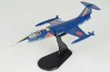 Blue and orange F-104J Starfighter 1/72 model on black display stand, wings visible