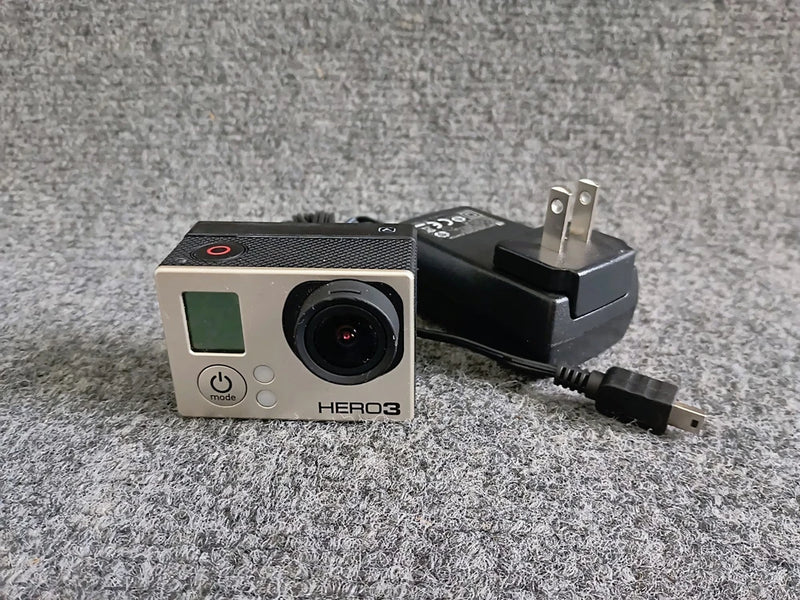 GoPro HERO3 action camera in silver with front lens and small LCD screen