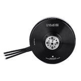 Black drone motor with circular housing, center mounting plate, and two cable leads