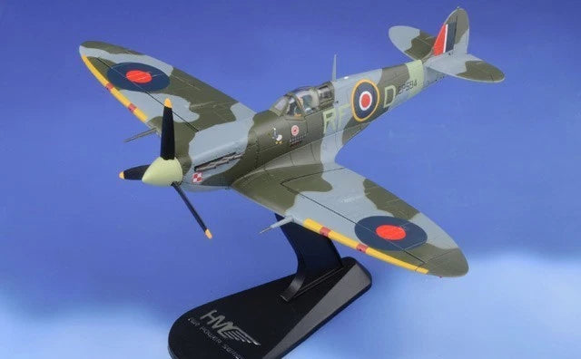 Spitfire scale model aircraft with green camouflage, RAF roundels, and grey stand