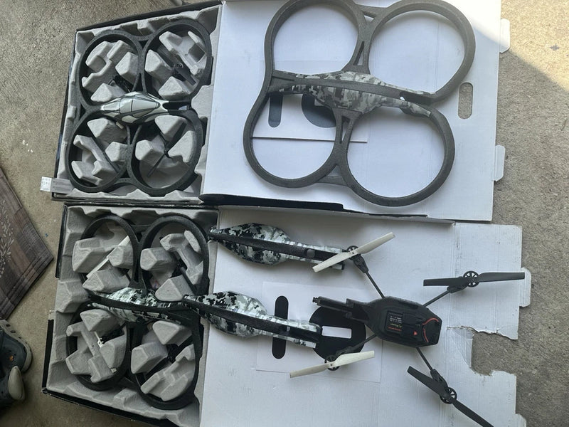 Camouflage Parrot quadcopter drone with spare propellers and protective frames