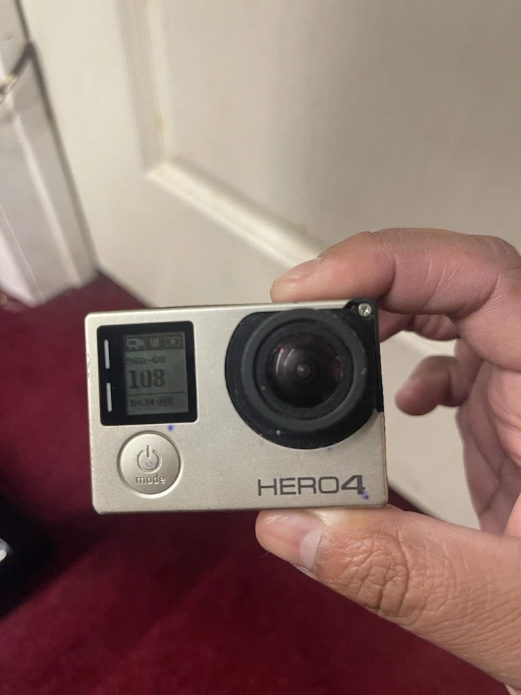 GoPro HERO4 action camera with front lens and small screen, gray body
