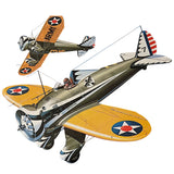 Olive green fighter airplane model with orange wings, propeller, and star insignia.