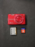 Red Fujifilm FinePix digital camera with lens and 4GB memory card