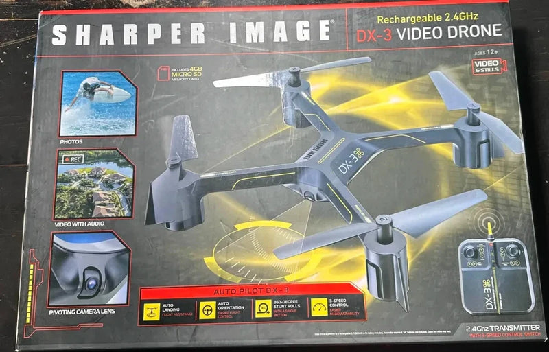 Video drone DX-3 quadcopter in retail box, gray body with yellow accents