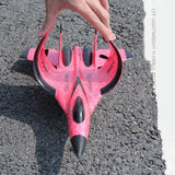 Red and pink EPP foam RC fighter plane with black nose, front view