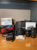 Canon EOS Rebel T3i digital DSLR camera kit with lenses, battery, and charger