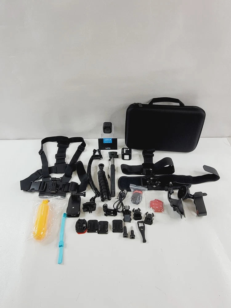 Black action camera kit with hard case, mounts, straps, selfie stick, and accessories