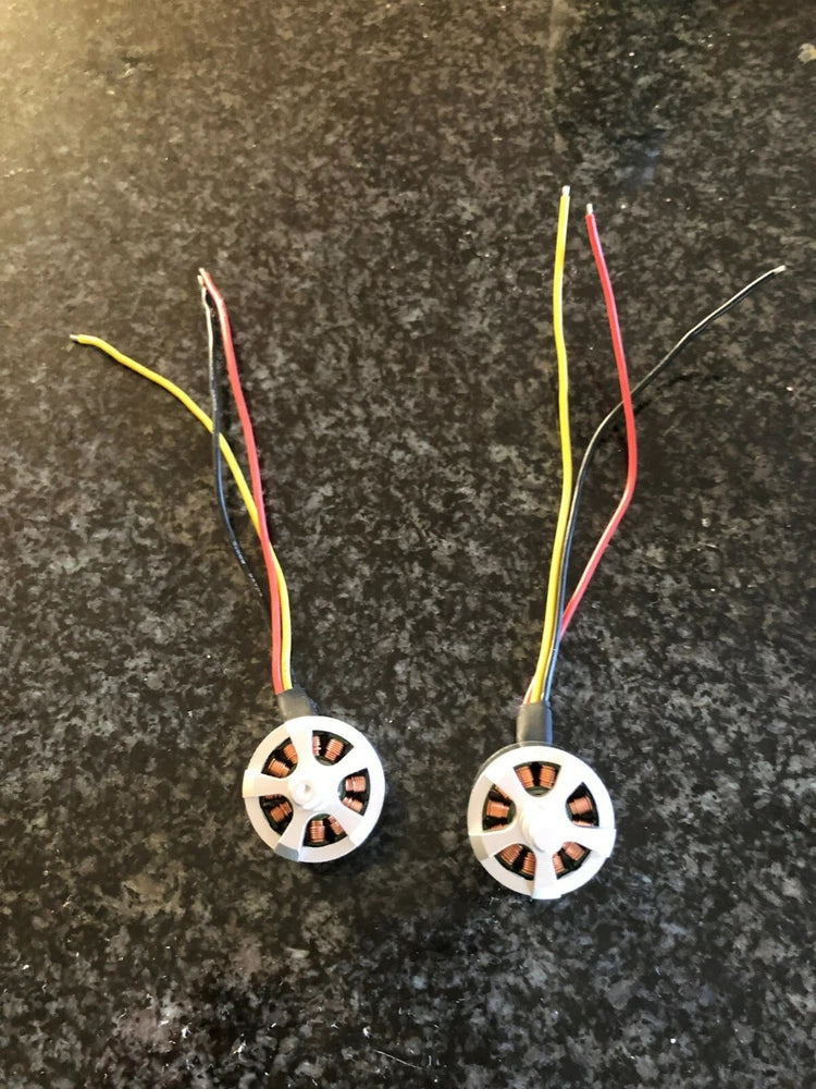 UpAir drone brushless motors with circular stator and colored power wires, pair