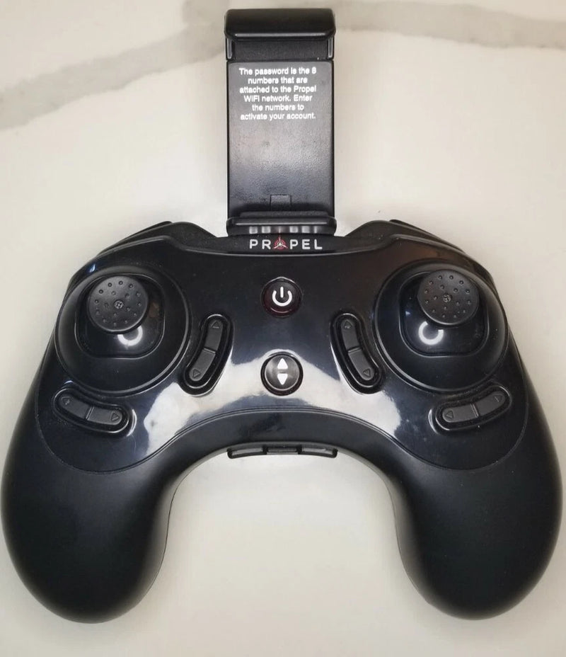 Drone remote controller with dual joysticks, power button, and central controls, black