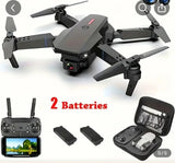 Foldable quadcopter drone with HD dual camera, controller, and two batteries