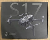 Foldable mini drone with four propellers and camera on retail box