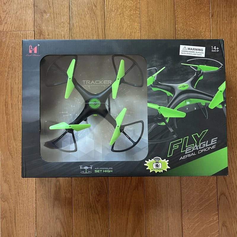 Green and black aerial drone retail box with warning label and drone graphics