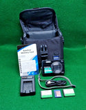 FinePix J250 camera kit in black case with charger, batteries and memory cards