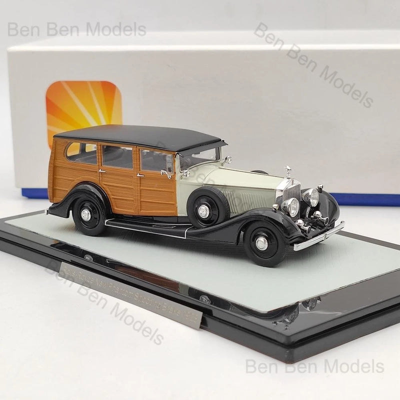 1:43 resin model car, classic 1928 style with dark chassis, tan sides, and black roof
