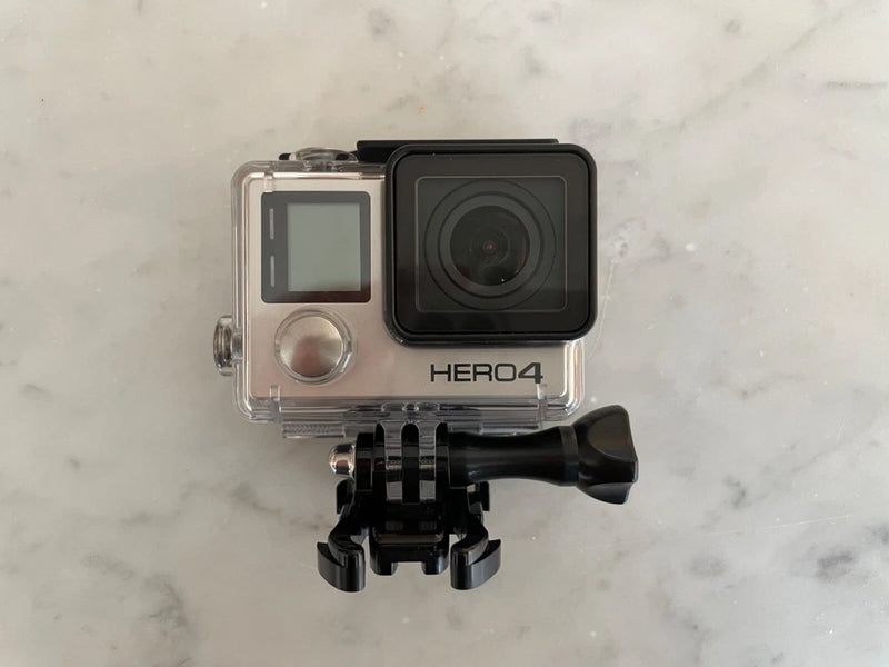 Black HERO4 action camera in clear waterproof housing with mounting bracket