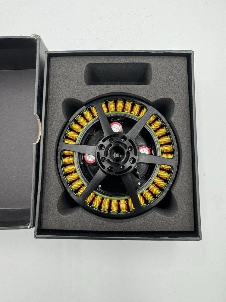 Drone propulsion motor module kit with circular stator and yellow windings in foam box