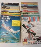 Vintage model airplane magazine lot with colorful aircraft cover designs, multiple issues stacked