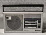 Panasonic AM/FM portable radio with speaker grille, tuning dial, power and volume controls