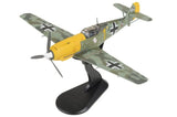 1/48 scale fighter aircraft model in yellow and gray camouflage on black stand