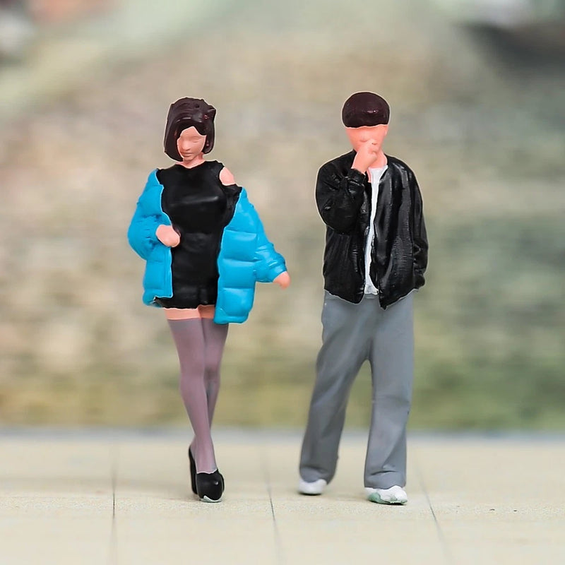 1/64 scale street-style couple mini figurines: woman in blue jacket, man in black jacket