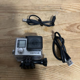 GoPro HERO4 Silver digital action camera in case with LCD, lens, and USB cable