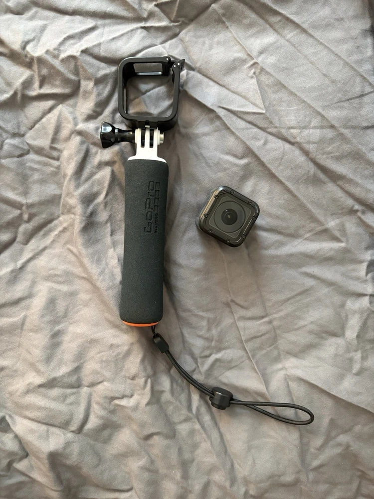 GoPro HERO4 Session action camera with floating grip and wrist strap