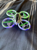 RC mini drone with four RGB LED ring propellers and green center body
