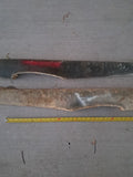 Gray airplane fiberglass mold section with damage; yellow tape measure across for size