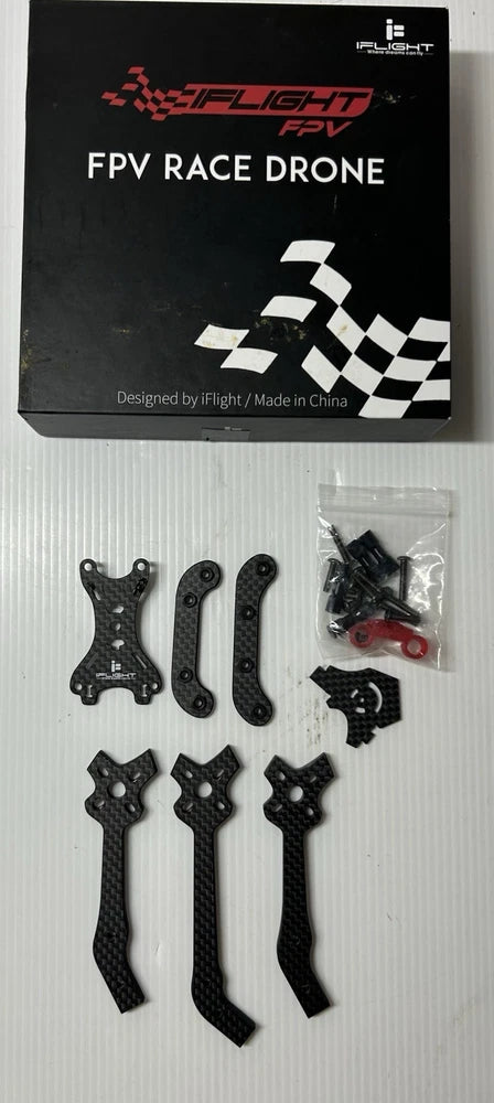 iFlight FPV race drone parts set with black mounting plates and hardware in bag