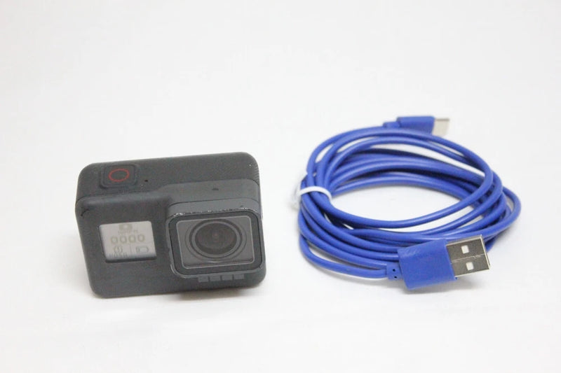 GoPro Hero5 action camera with black body and blue USB cable