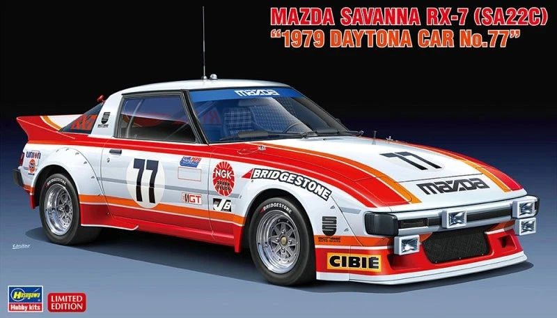 White and red racing model car kit with orange stripe, front three-quarter view