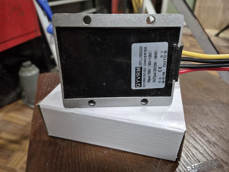DC-DC converter module with metal casing and label, with wire terminals