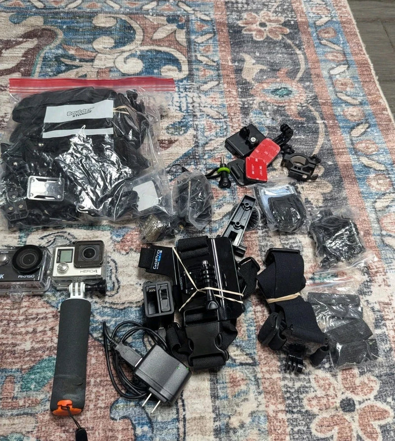 Action camera accessories bundle with mounts, battery packs, straps, and cases