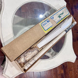 RC balsa airplane kit wing panel and fuselage tubes in packaging