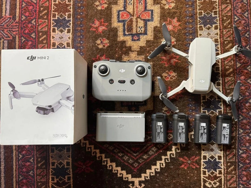 DJI Mini 2 drone kit with remote, foldable drone and four batteries