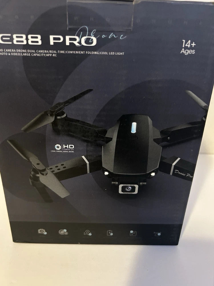 Black foldable quadcopter drone with front camera and propellers