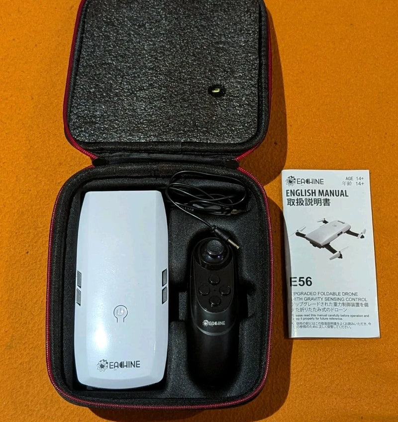 Folding drone and remote controller in zippered protective case with manual