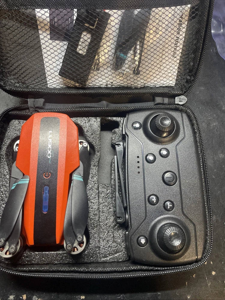 RC drone control remote and orange module in carrying case