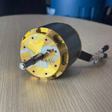 Scorpion brushless motor with gold end cap, metal shaft, and attached wires