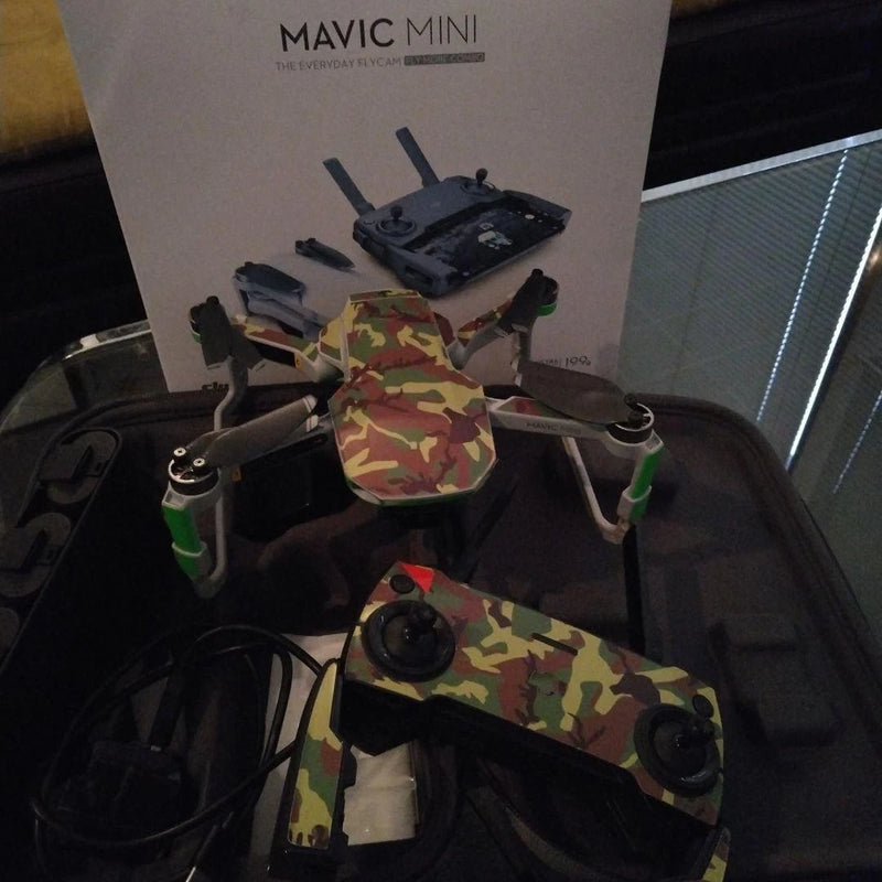Dji Mavic Mini quadcopter drone with camo body and four propellers