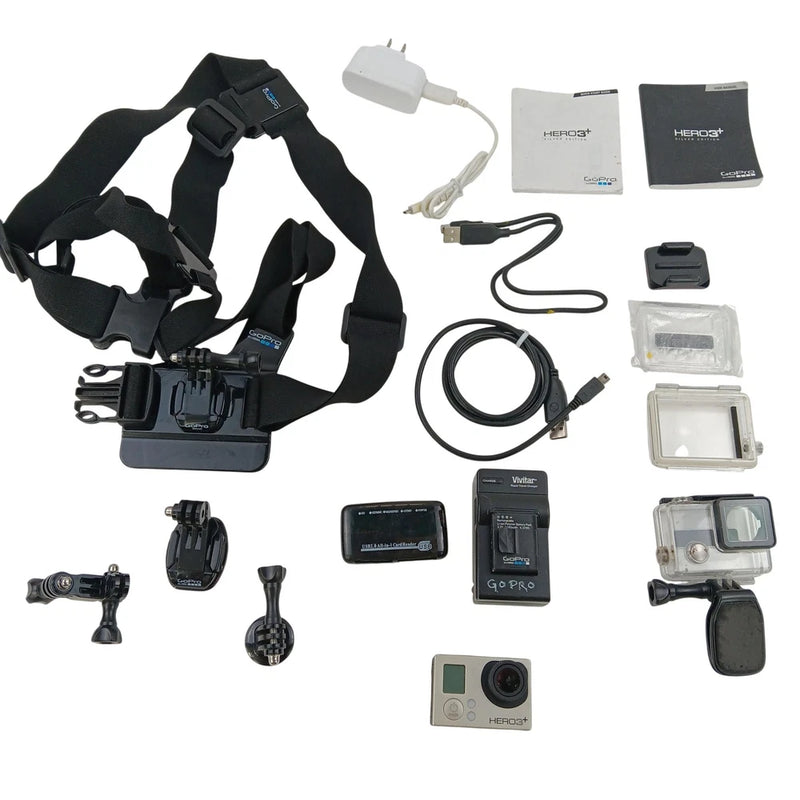 Action camera kit with camera, handheld mounts, straps, battery charger and cases